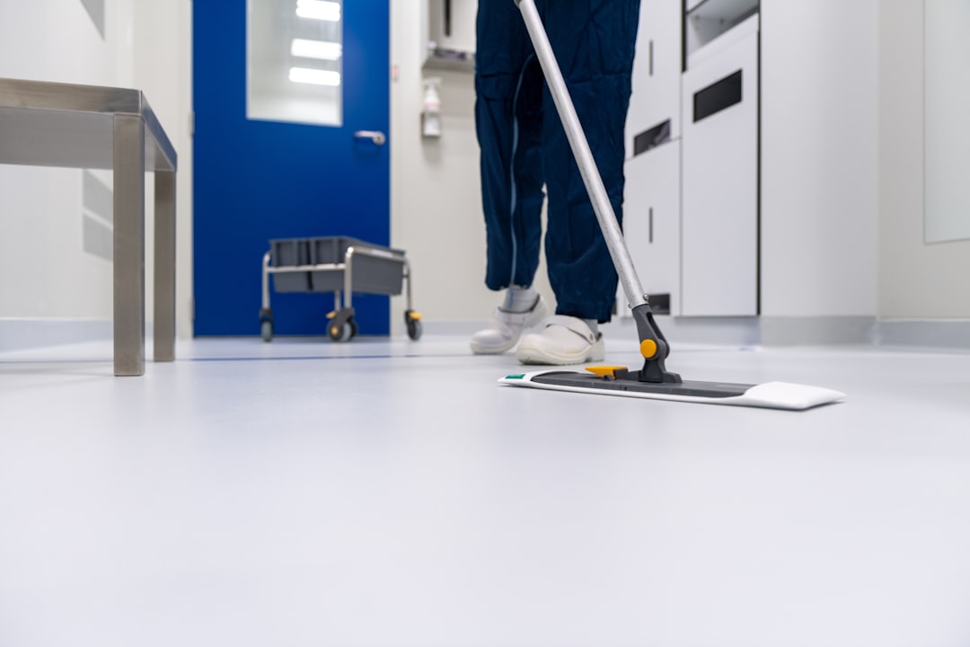 services-02 Cleaner cleaning the floor in a laboratory environment